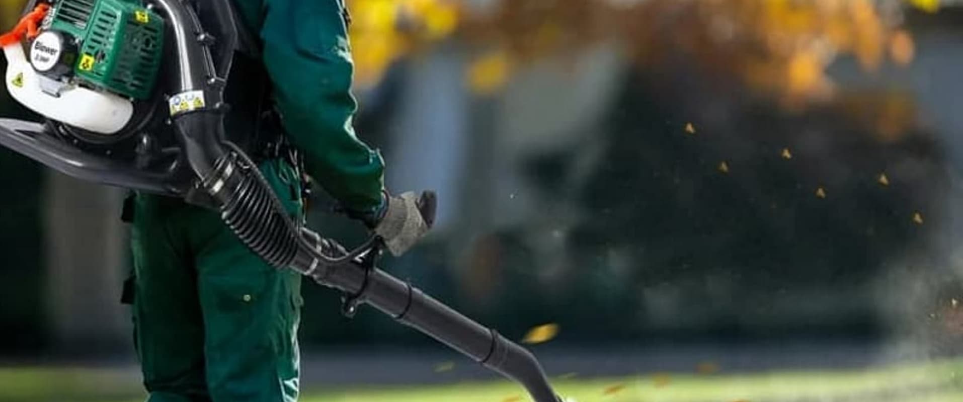 Lawncare worker maintaining property